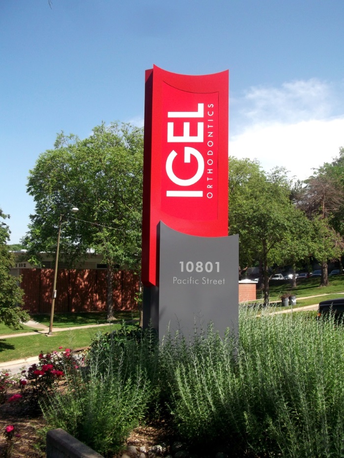 Illuminated, double-face Igel Orthodontics monument sign