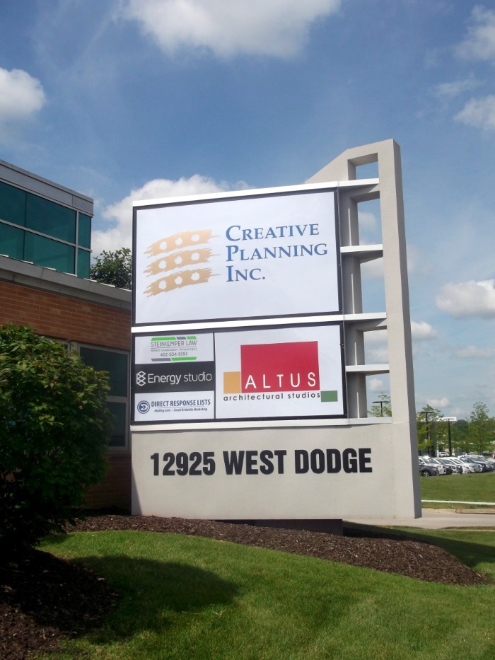 Illuminated, double-face tenant monument sign at 12925 West Dodge Road at