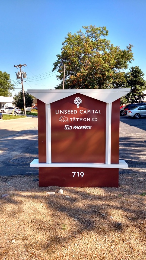Non-illuminated, double-face tenant monument sign at 719 south 75th street
