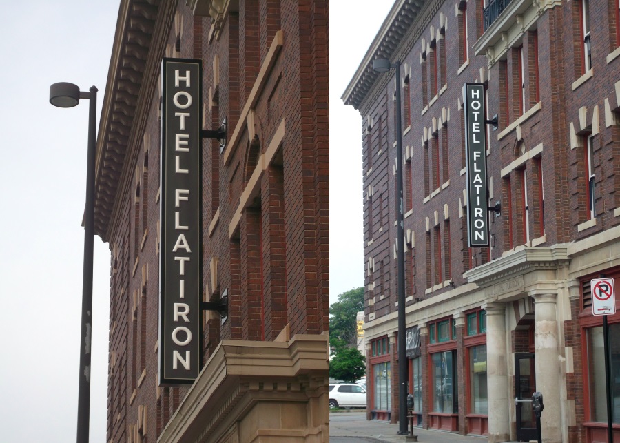 Illuminated, double-face Hotel Flatiron projecting sign located downtown